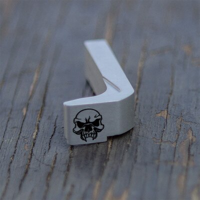 Engraved magazine release with Skull design