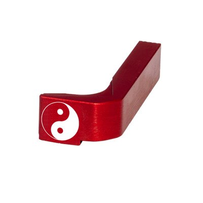 Yin Yang symbol engraved on a magazine release engraved by Glockstore